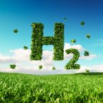 Eco friendly clean hydrogen energy concept. 3d rendering of hydrogen icon on fresh spring meadow with blue sky in background.