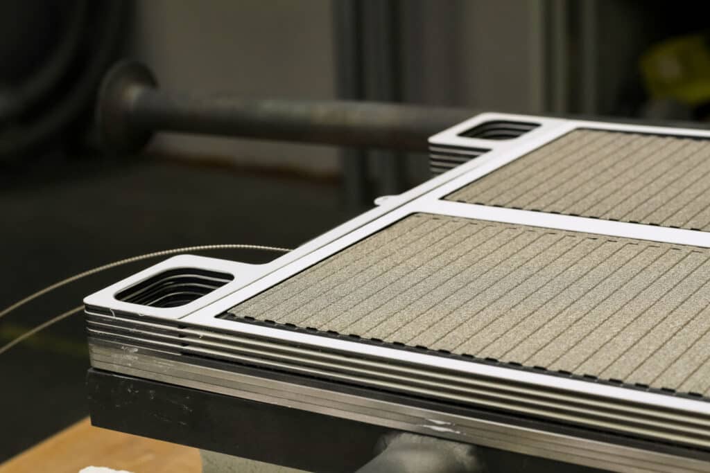 Close-up of an advanced electrochemical cell stack assembly for fuel cell and electrolysis energy systems.