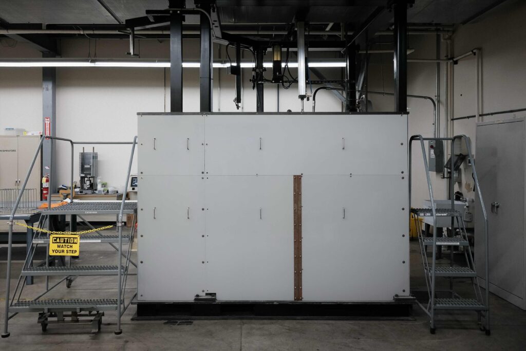 Industrial elevator kiln for large-batch sintering and thermal processing of advanced materials.